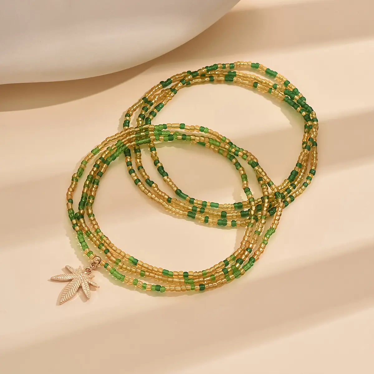 2Pcs Maple Leaf Pendant Anklet Set, Bohemian Colorful Beads Stackable Ankle Bracelet, Green Beads Multi-layer Mini Seed Beads Elastic Foot Chain Bracelet, Vacation Travel Summer Beach Foot Bracelet Jewelry