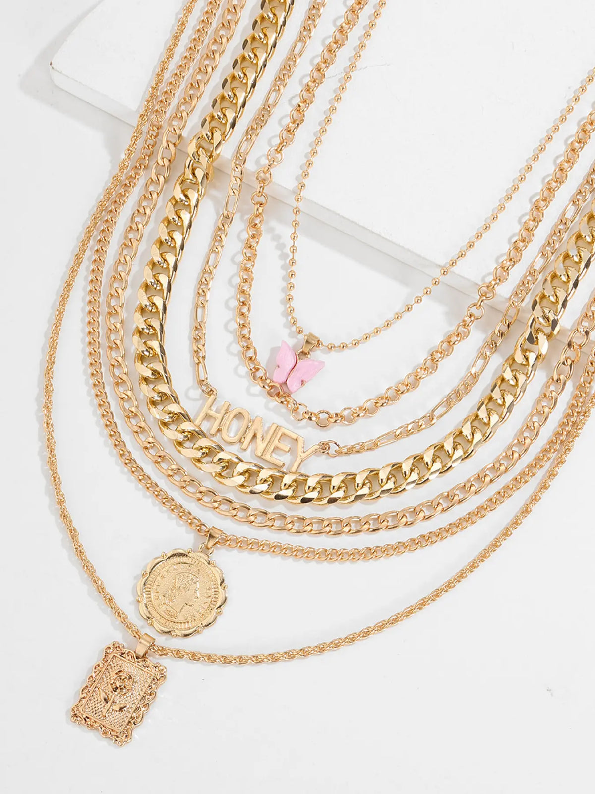 7-Piece Golden Layered Y2K Necklace Set with 'HONEY' Letter, Butterfly & Coin Charms Edgy Chic Accessory, Fashion Matching Boho Style Necklace for Daily, Party & Music Festival