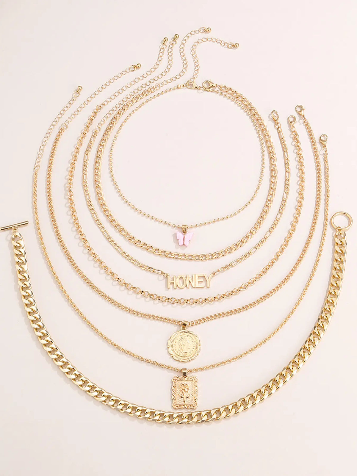 7-Piece Golden Layered Y2K Necklace Set with 'HONEY' Letter, Butterfly & Coin Charms Edgy Chic Accessory, Fashion Matching Boho Style Necklace for Daily, Party & Music Festival